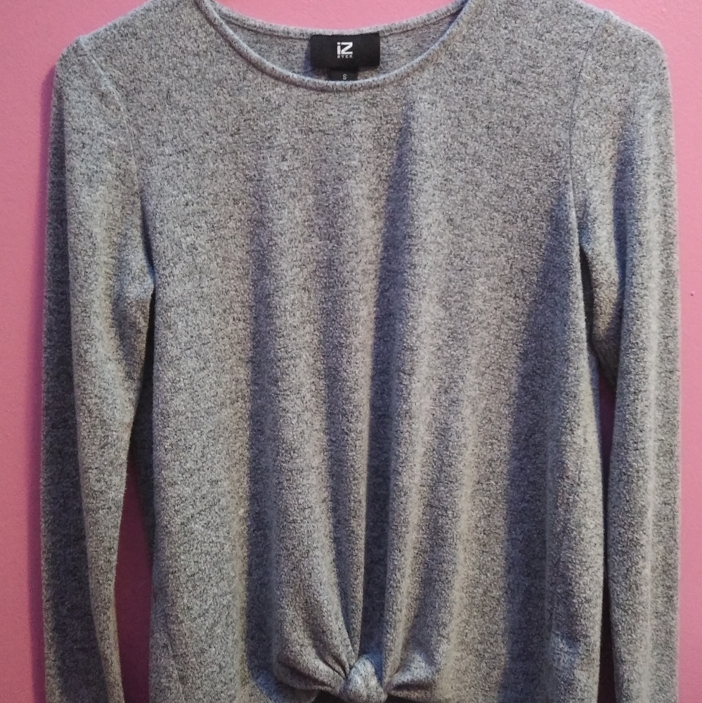 Gray sweater with tie at the bottom.